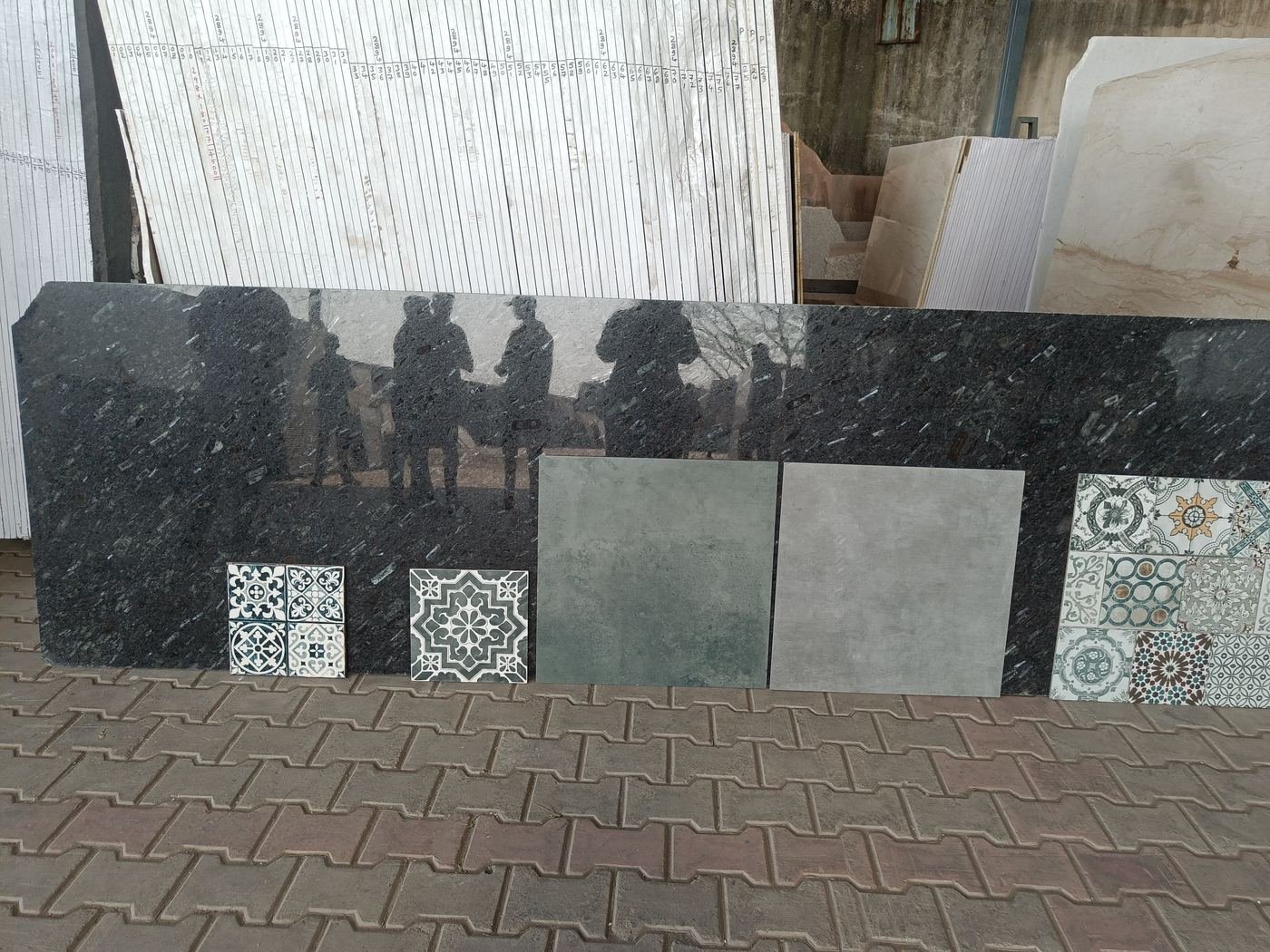 Granite slabs and tile samples laid out on site