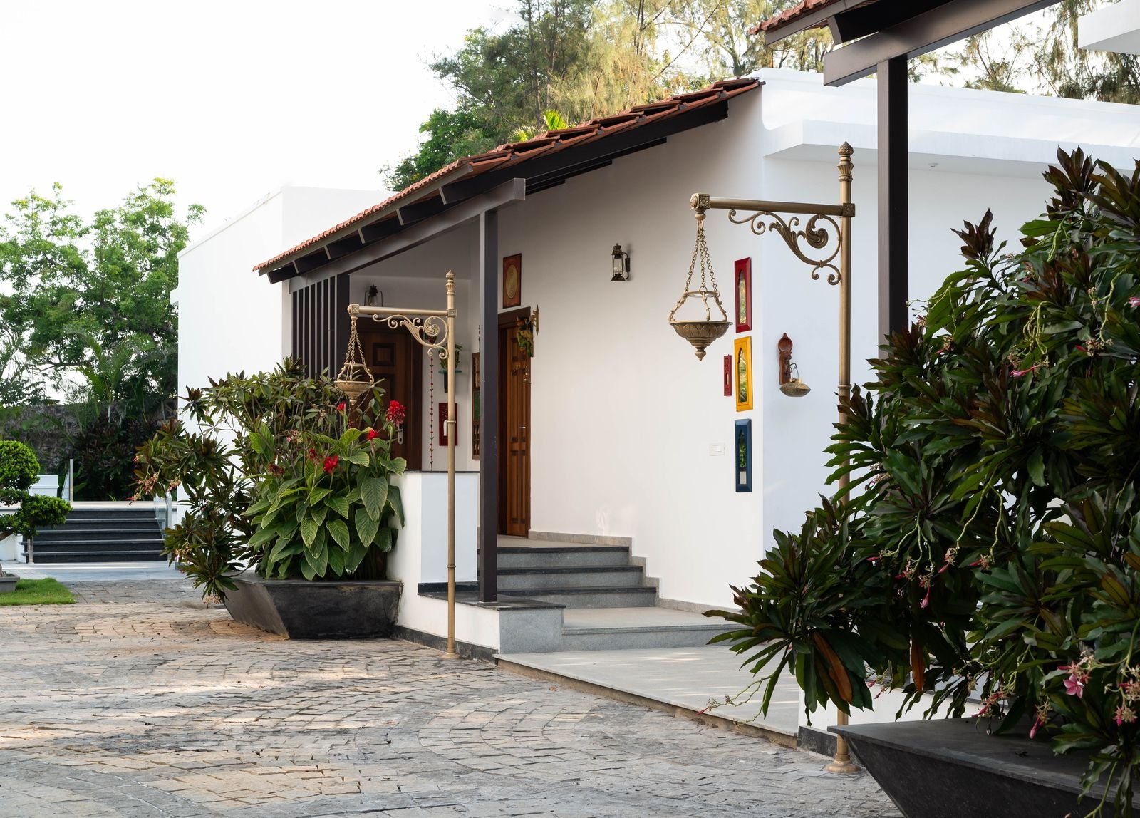 Cottage verandah with brass lamps